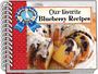 „Our Favorite Blueberry Recipes“ steht oben. Logo: Eine Gans mit blauem Band. Ein Heidelbeerkuchen mit Zuckerguss.