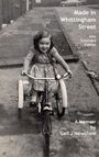 Titel: Made in Whittingham Street, New Extended Edition. A Memoir by Gail J Newsham. Ein Kind fährt lächelnd ein Dreirad.