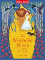 Text: "The Wonderful Wizard of Oz", "L. Frank Baum". Illustration: Zinnmann, Löwe, Dorothy, Vogelscheuche auf gelbem Weg mit Blumen.
