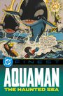 Text: "FINESST", "AQUAMAN", "THE HAUNTED SEA". Illustration: Zwei Orcas im Ozean, Magier mit Zauberstab, zwei schwimmende Figuren.