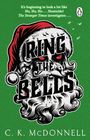 Oben: "It's beginning to look a lot like Ho, Ho, Ho... Homicide! The Stranger Times investigates..." Darunter: "RING THE BELLS". Ein stylisiertes Santa Claus Gesicht auf grünem Hintergrund. Unten: "C. K. McDONNELL".