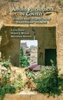 "Applied Psychology in Context: Stories and Lessons from Palestinian Villages" von Caesar Hakim, Hamish J. McLeod, Mohammad Alkhatib. Eine alte Steinmauer mit Blick auf traditionelle Gebäude und grüne Pflanzen.