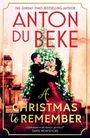 Text: "Anton Du Beke", "A Christmas to Remember". Tanzendes Paar vor geschmücktem Weihnachtsbaum, elegante Abendgarderobe.