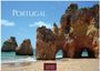 "Portugal. 2027. CASAES EDITION." Felsformationen am Strand unter einem blauen Himmel mit Wolken.