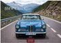 "BMW Classic Cars", "2027", "CASARES EDITION". Ein blauer Oldtimer auf einer Bergstraße, umgeben von grünen Hügeln.