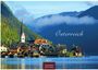Text: "Österreich", "2027", "CASARES EDITION". Im Hintergrund Berge, vorne ein malerisches Dorf mit Kirche am See.