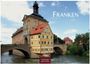Großer Text: "FRANKEN". Darunter: "by H.W. Schawe". Unten: "2027 CASA.RE.S EDITION". Historisches Gebäude auf Brücke.