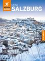 Text: "ROUGH GUIDES MINI SALZBURG" und "Free eBook". Winterlandschaft von Salzburg, verschneite Gebäude und Festung.