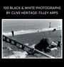 "100 Black & White Photographs by Clive Heritage-Tilley ARPS." Kiesstrand mit Anglern und Wellen im Hintergrund.