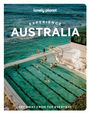 Text: "Lonely Planet Experience Australia. Get away from the everyday."  
Szene: Ein Pool am Meer mit Schwimmern.