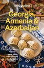 Text: "Georgia, Armenia & Azerbaijan. Drive the Georgian Military Highway. Explore Soviet-era architecture. Hike the Greater Caucasus." Einrichtungstisch mit gefüllten Teigtaschen und Salat.