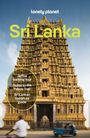 Geflockte Texte: "Jaffna walking tour", "Guide to the Pekoe Trail", "Sri Lankan literature guide". Gelber Tempel im Hintergrund.