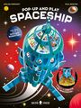 Text: "POP-UP AND PLAY SPACESHIP", "WRITTEN BY A ROCKET SCIENTIST!", "UNFOLD TO CREATE A 3D SPACESHIP!". Illustration: Raumschiff im Weltraum.