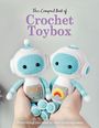 "The Compact Book of Crochet Toybox. Everything you need to start creating today." Zwei gehäkelte Roboter in Händen gehalten.