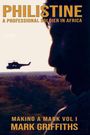 "PHILISTINE A PROFESSIONAL SOLDIER IN AFRICA" und "MAKING A MARK VOL I MARK GRIFFITHS" in Großbuchstaben. Profil eines Mannes vor einem Helikopter.