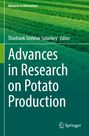 "Advances in Research on Potato Production" von Shashank Shekhar Solankey. Feld mit grünen Pflanzen in Reihen.