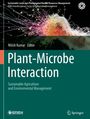 "Plant-Microbe Interaction" von Nitish Kumar. Illustration von farbigen Wurzeln auf grünem Hintergrund.