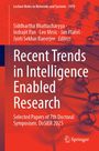 „Recent Trends in Intelligence Enabled Research“ vor einem abstrakten Muster aus vernetzten Kugeln.