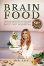 "Brain Food: 50+ nourishing recipes." Eine Frau mit Salat in der Küche, Gemüse und Gewürze auf einem Tisch.