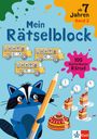 "Mein Rätselblock", "ab 7 Jahren", "Band 2", "100 kunterbunte Rätsel". Illustration: Waschbär mit Stift, Busse, Uhren, Tortenstücke.