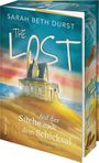 „The Lost. Auf der Suche nach dem Schicksal. Roman.“ zeigt ein Haus am Meer mit stürmischen Wellen und einer Straße.
