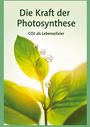"Die Kraft der Photosynthese: CO2 als Lebenselixier." Grüne Blätter mit CO2- und O2-Symbolen, von Licht umgeben.