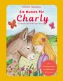 "Ein Wunsch für Charly. Ein kleiner Esel findet sein Glück." Illustration: Kind kuschelt mit Esel in bunter Blumenwiese.