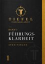 "Band 1: Führungsklarheit Arbeitsbuch." Ein schwarzes Cover mit goldenen und weißen Schriftzügen und einem Logo oben.