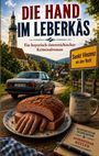 „Die Hand im Leberkäs“; ein bayerisch-österreichischer Kriminalroman; Schild: „Sankt Vinzenz an der Rott“; Tasse mit Aufschrift.