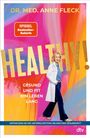 Oben steht "DR. MED. ANNE FLECK", darunter "HEALTHY!" in großen Buchstaben. Eine Frau im Arztkittel lächelt.