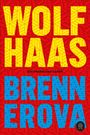 "WOLF HAAS" und "BRENNEROVA" in großen Buchstaben. Roter Hintergrund mit geometrischem Muster in Gelb und Blau.