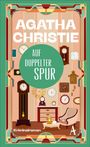 Buchtitel: "Agatha Christie - Auf doppelter Spur". Illustration: Viele Uhren in einem Raum, Sessel und Tisch mit Teekanne.