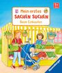 "Mein erstes Sachen suchen: Beim Einkaufen" ist oben. Illustration eines Marktstands mit Frau, Kind im Kinderwagen und Gemüseständen.