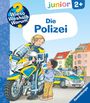 "Die Polizei" steht groß im Zentrum. Eine Polizistin mit Motorrad spricht mit einem Kind, im Hintergrund Polizeiauto.