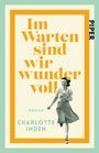 "Im Warten sind wir wundervoll", Roman von Charlotte Inden, darunter lächelt eine Frau im Rock.