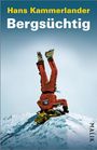 Oben steht "Hans Kammerlander", darunter "Bergsüchtig". Ein Kletterer im roten Anzug macht einen Handstand im Schnee.