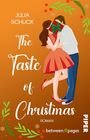 „Julia Schuck. The Taste of Christmas. Roman.“ Illustration: Paar küsst sich hinter Geschenk, mit Weihnachtsdeko umgeben.