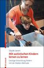 Sibylle Janert: Mit autistischen Kindern lernen zu lernen. Zwei Personen arbeiten zusammen an einem Projekt mit Tannenzapfen.