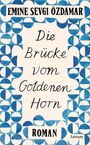 „EMINE SEVGI ÖZDAMAR. Die Brücke vom Goldenen Horn. ROMAN.“ Blaue geometrische Muster als Rahmen.