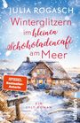 "Winterglitzern im kleinen Schokoladencafé am Meer" steht über einem verschneiten Haus mit blauem Dach und warmem Licht.