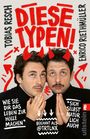 Zwei Männer mit roten Teufelshörnern und Bärten, die andächtig blicken. Text in Rot: „DIESE TYPEN!“, daneben ihre Namen.