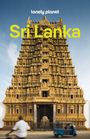 Text: "lonely planet", "Sri Lanka". Goldener Tempel, detailreich verziert. Blaues Dreirad und Mann auf Fahrrad im Vordergrund.