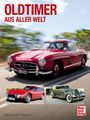 OLDTIMER AUS ALLER WELT. Drei Oldtimer: ein roter, ein klassischer cremefarbener und ein sportlicher roter Wagen.