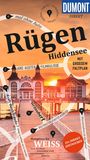 DUMONT DIREKT; Rügen; Hiddensee; MIT GROSSEM FALTPLAN; Hauptsache WEISS; Ein Steg führt zu einem weißen Gebäude im Sonnenuntergang.