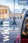 Text: DUMONT Reise-Taschenbuch, wien. Eine Straßenbahn vor einem historischen Gebäude mit Säulen.