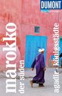 "DUMONT Reise-Taschenbuch, marokko, der süden, agadir, königsstädte." Ein Mann in lila Gewand vor rosa Wand mit blauer Tür.