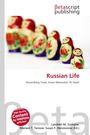 "Russian Life" mit Untertitel "Nuremberg Trials, Enver Mamedov, Al Fateh". Im Hintergrund bunte Matroschka-Puppen.