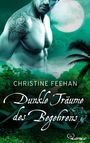 Text: "Christine Feehan, Dunkle Träume des Begehrens." 
Ein tätowierter, muskulöser Mann vor einem Dschungel und Vollmond.