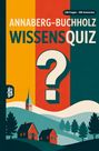 "ANNABERG-BUCHHOLZ WISSENSQUIZ" in großen Buchstaben, darunter eine Illustration mit Fragezeichen, Häusern und einer Kirche.