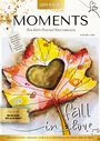„MOMENTS: Dein Happy Painting! Kreativmagazin. Fall in Love. Bist du bereit, dich zu verlieben?“  
Ein buntes Ahornblatt mit Herzmotiv.